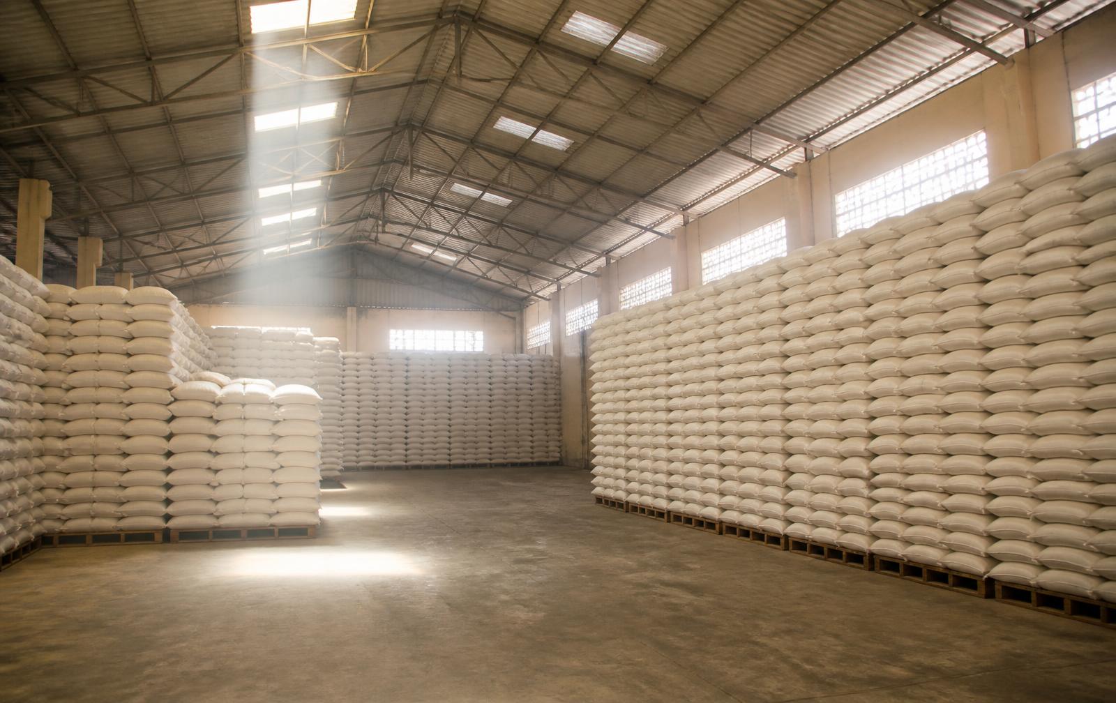 Stacked fertilizer sacks inside a Premium Agro warehouse